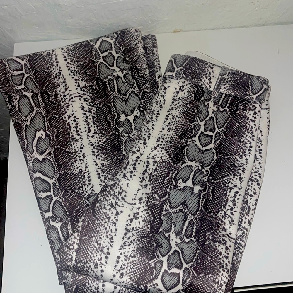 Trendy snake flare pants